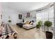 Bright living room with neutral colors, tile floor, and comfortable seating at 1083 E Normandy Blvd, Deltona, FL 32725