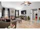 Comfortable living room with neutral tones, tile floors, and a large flat screen television at 1083 E Normandy Blvd, Deltona, FL 32725
