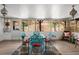 Inviting sunroom with comfortable seating, decorative lighting, and ample natural light at 1083 E Normandy Blvd, Deltona, FL 32725