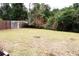Backyard featuring a lawn and a wood fence at 1201 Buccaneer Ave, Deltona, FL 32725