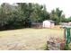 Spacious backyard featuring a storage shed and ample greenspace at 1201 Buccaneer Ave, Deltona, FL 32725