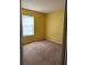 Bright bedroom with yellow walls and carpet flooring at 1201 Buccaneer Ave, Deltona, FL 32725