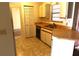 Small kitchen with white cabinets and laminate countertops at 1201 Buccaneer Ave, Deltona, FL 32725