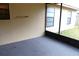 Neutral screened porch featuring a gray floor and outdoor access at 1201 Buccaneer Ave, Deltona, FL 32725
