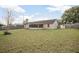 Large backyard with grassy lawn and screened porch at 1267 Saxon Blvd, Deltona, FL 32725