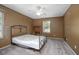 Bedroom with ceiling fan, window, and a full-size bed at 1267 Saxon Blvd, Deltona, FL 32725
