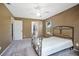 Spacious bedroom with ceiling fan and access to bathroom at 1267 Saxon Blvd, Deltona, FL 32725