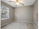Simple bedroom with a window and ceiling fan at 1267 Saxon Blvd, Deltona, FL 32725