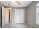 Bright bedroom with double door closet and ceiling fan at 1267 Saxon Blvd, Deltona, FL 32725