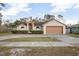 Single-story house with attached garage and neatly trimmed shrubs at 1267 Saxon Blvd, Deltona, FL 32725