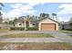 Single-story house with attached garage and landscaped front yard at 1267 Saxon Blvd, Deltona, FL 32725