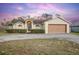 Single-story house with attached garage and landscaped front yard at 1267 Saxon Blvd, Deltona, FL 32725