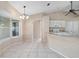 Kitchen features a breakfast bar, ample cabinetry, and tile flooring at 1267 Saxon Blvd, Deltona, FL 32725