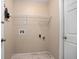 Empty laundry room with hook, shelving, and plumbing hookups at 1267 Saxon Blvd, Deltona, FL 32725
