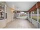 Relaxing screened porch with ceiling fan, offering backyard views at 1267 Saxon Blvd, Deltona, FL 32725