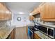 Kitchen with granite countertops and oak cabinets at 1540 Primrose Ln, Daytona Beach, FL 32117