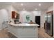 Modern kitchen features a large island and stainless steel appliances at 1600 Lady Fern Trl, Deland, FL 32720