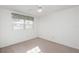 Bright and simple bedroom featuring neutral carpet and a window with natural light at 225 N Hill Ave # 60, Deland, FL 32724