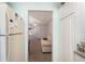 Bright kitchen entrance with a glimpse into the spacious living room at 225 N Hill Ave # 60, Deland, FL 32724