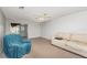 Cozy living room with neutral carpet, ceiling fan, and access to an outdoor patio area at 225 N Hill Ave # 60, Deland, FL 32724
