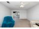 Cozy living room with neutral carpet, ceiling fan, and access to an outdoor patio area at 225 N Hill Ave # 60, Deland, FL 32724
