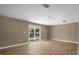 Living area with sliding doors and ceiling fan at 2318 Fairgren Ave, Deltona, FL 32738