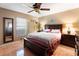 Bedroom with a comfortable bed and dark wood furniture at 2392 Laredo Dr, Deltona, FL 32738