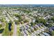 Aerial view of the neighborhood showcasing well-maintained homes and tree-lined streets at 4619 Barnacle Dr, Port Orange, FL 32127