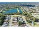 Scenic aerial shot showcases a tranquil lake surrounded by a charming residential community at 4619 Barnacle Dr, Port Orange, FL 32127