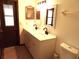 A bathroom with double sinks and door to outside at 641 Fairhaven St, Deltona, FL 32725