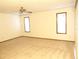 Large bedroom with carpet, ceiling fan, and two windows at 641 Fairhaven St, Deltona, FL 32725