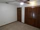 Bright bedroom with wood closet doors and carpet flooring at 641 Fairhaven St, Deltona, FL 32725