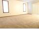 Spacious bedroom with carpet, two windows and sliding door at 641 Fairhaven St, Deltona, FL 32725