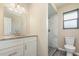 Bathroom featuring a marble tiled shower, granite countertop, and new fixtures at 779 Victoria E Cir, Ormond Beach, FL 32174