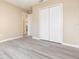 Spacious bedroom with modern flooring, neutral paint, and closet access at 779 Victoria E Cir, Ormond Beach, FL 32174