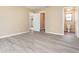 Bedroom with contemporary floors, neutral walls, and access to en-suite bathroom and closet at 779 Victoria E Cir, Ormond Beach, FL 32174