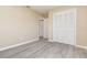 Bedroom featuring modern flooring, neutral walls, and a spacious closet at 779 Victoria E Cir, Ormond Beach, FL 32174