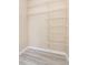 Walk-in closet features wire shelving and laminate flooring for organized storage at 779 Victoria E Cir, Ormond Beach, FL 32174