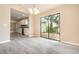 Open-concept living area featuring lots of light and a view into the kitchen at 779 Victoria E Cir, Ormond Beach, FL 32174