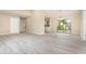 Spacious living area with wood-look floors and plenty of natural light at 779 Victoria E Cir, Ormond Beach, FL 32174