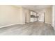Open-concept living area showcasing wood-look floors and neutral paint colors at 779 Victoria E Cir, Ormond Beach, FL 32174