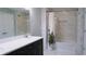 Clean bathroom boasts a bathtub, double vanity, and updated tile at 855 E Church St, Deland, FL 32724