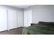 Bedroom with large closets and dark wood floors at 855 E Church St, Deland, FL 32724