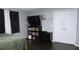 Spacious bedroom with large closets and dark hardwood floors at 855 E Church St, Deland, FL 32724