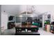Spacious living room with ample natural light and a view of the dining area at 855 E Church St, Deland, FL 32724