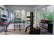 Bright sunroom with large windows, musical instruments, and ample storage at 855 E Church St, Deland, FL 32724