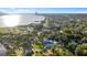 Beautiful aerial shot of the property offering waterfront views, lush greenery, and a glimpse of the neighborhood at 1146 Riverside Dr, Daytona Beach, FL 32117