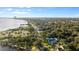 Stunning aerial view highlighting the proximity to the water, tree coverage, and neighborhood landscape at 1146 Riverside Dr, Daytona Beach, FL 32117