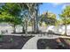 Backyard featuring a white gravel seating area around a fire pit and a well-maintained lawn at 1146 Riverside Dr, Daytona Beach, FL 32117