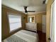 Comfortable bedroom featuring a ceiling fan, and a dresser with mirror at 1146 Riverside Dr, Daytona Beach, FL 32117
